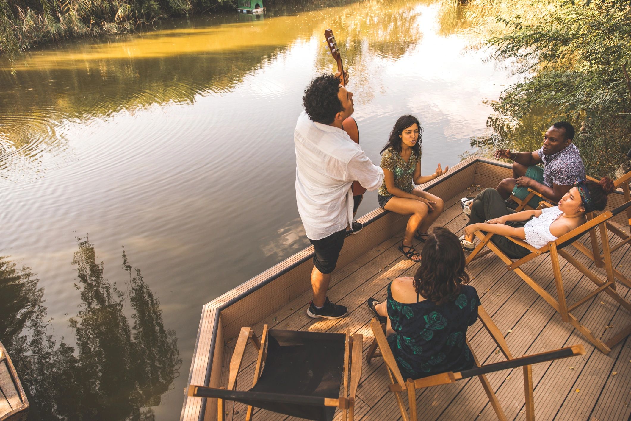 People gathered by the water enjoying time together